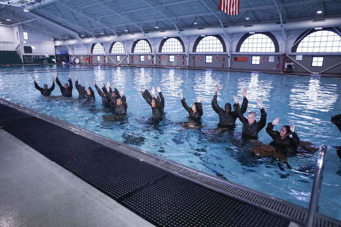 Recruits from Kilo Company, 3rd Recruit Training Battalion, conduct swim qualification remediation on Marine Corps Recruit Depot Parris Island, S.C., Dec. 15, 2021. Recruits who fail their initial swim qualification are required to return for additional training. (U.S. Marine Corps photo by Lance Cpl. Colin Harper)