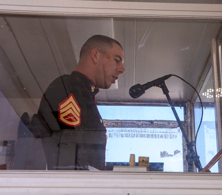 Staff Sgt. Mark Gulotta, with Recruit Training Regiment, narrates a recruit graduation on Marine Corps Recruit Depot  Parris Island, S.C., Feb 25, 2022. Gulotta completed his first graduation ceremony on February 25. (U.S. Marine Corps photo by Lance Cpl. Michelle Brudnicki)