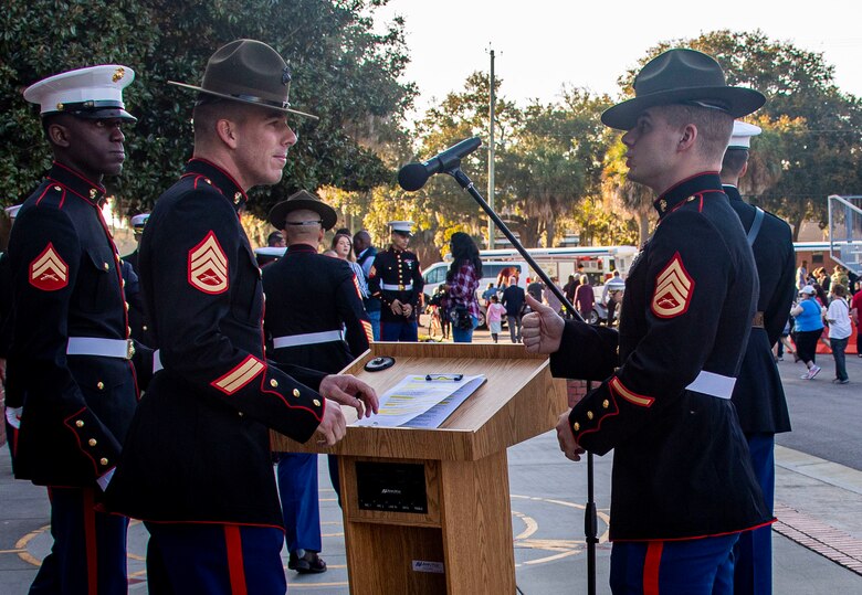 Staff Sgt. Christopher Davis and Staff Sgt. Mark Gulotta, with the Recruit Training Regiment, discuss vocal techniques on Marine Corps Recruit Depot Parris Island, S.C., Feb 25, 2022. "The Voice" is the title given to the Marine who is selected to be the narrator for official Parris Island ceremonies and events. (U.S. Marine Corps photo by Lance Cpl. Michelle Brudnicki)