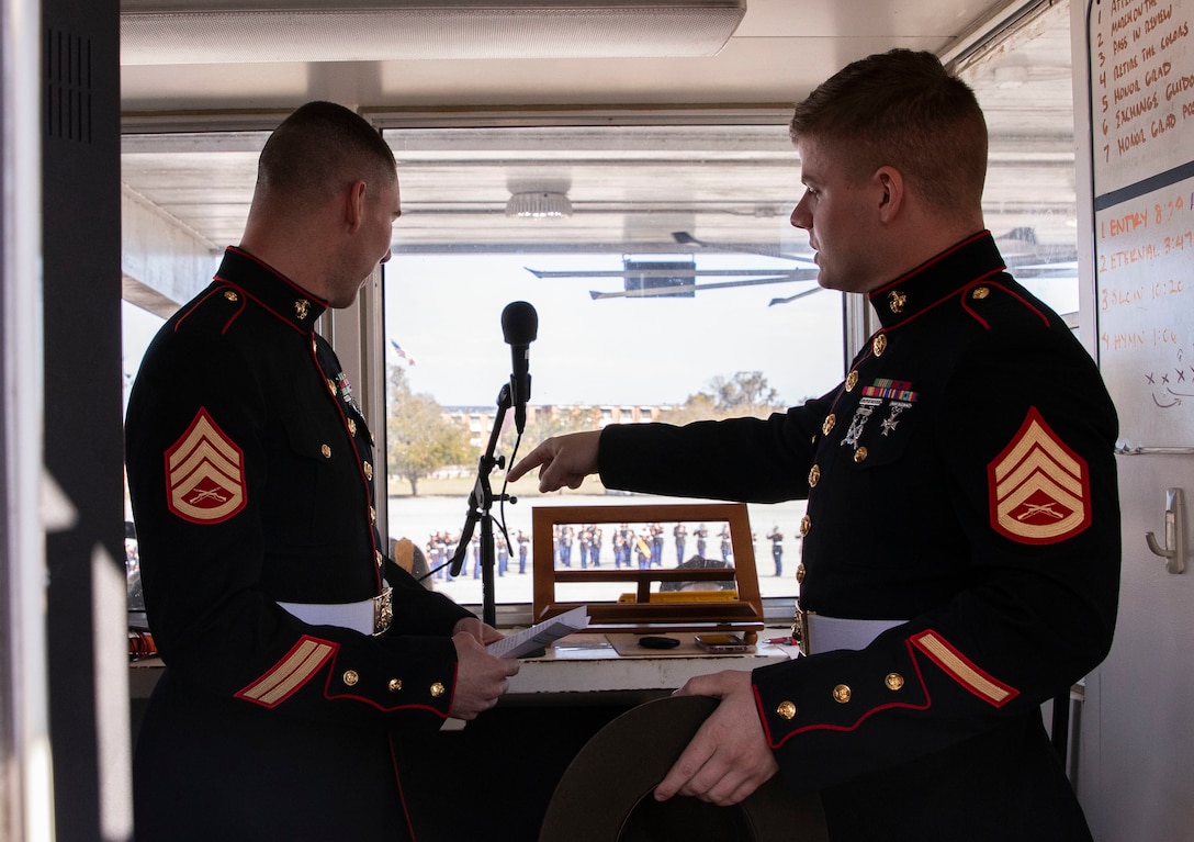 Staff Sgt. Christopher Davis and Staff Sgt. Mark Gulotta, with the Recruit Training Regiment, discuss vocal techniques on Marine Corps Recruit Depot Parris Island, S.C., Feb 25, 2022. "The Voice" is the title given to the Marine who is selected to be the narrator for official Parris Island ceremonies and events. (U.S. Marine Corps photo by Lance Cpl. Michelle Brudnicki)