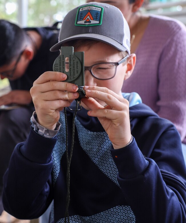 Boy Scouts from Troop 241 learn land navigation techniques aboard Marine Corps Recruit Depot Parris Island, S.C., on March 19, 2022. The scouts were taught the techniques by Field Training Company Instructors, and learned how to implement these techniques in their journeys as scouts to earn their Orienteering Merit Badge. 
(U.S. Marine Corps photo by Lance Cpl. Dakota Dodd)