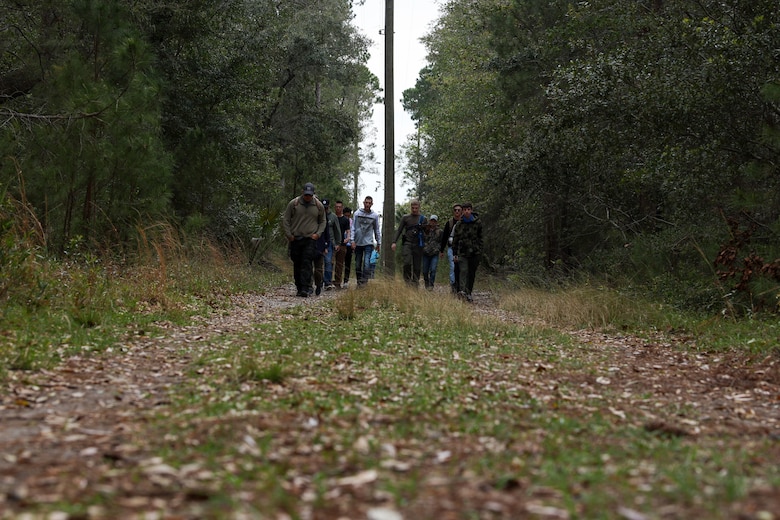 Boy Scouts from Troop 241 learn land navigation techniques aboard Marine Corps Recruit Depot Parris Island, S.C., on March 19, 2022. The scouts were taught the techniques by Field Training Company Instructors, and learned how to implement these techniques in their journeys as scouts to earn their Orienteering Merit Badge. 
(U.S. Marine Corps photo by Lance Cpl. Dakota Dodd)