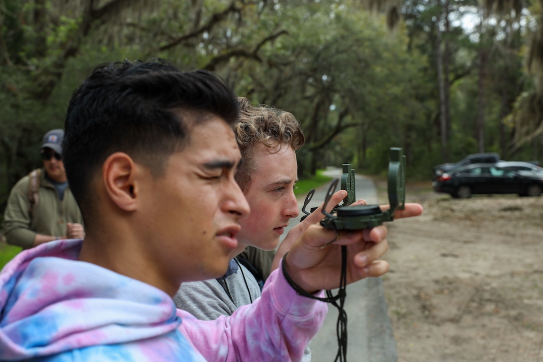 Boy Scouts from Troop 241 learn land navigation techniques aboard Marine Corps Recruit Depot Parris Island, S.C., on March 19, 2022. The scouts were taught the techniques by Field Training Company Instructors, and learned how to implement these techniques in their journeys as scouts to earn their Orienteering Merit Badge. 
(U.S. Marine Corps photo by Lance Cpl. Dakota Dodd)