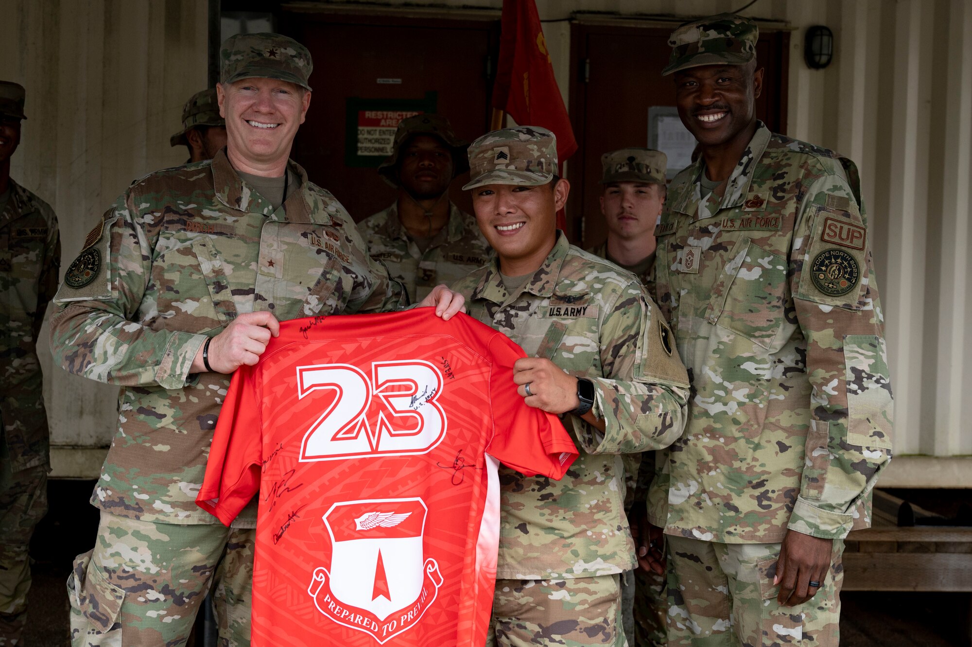U.S. Army Sgt. Jimmy Manila, the Battery E, 3rd Air Defense Artillery noncommissioned officer in charge assigned to the E-3 Terminal High Altitude Area Defense, receives the Linebacker of the Week Award from U.S. Air Force Brig. Gen. Paul Birch, commander of the 36th Wing and U.S. Air Force Chief Master Sgt. Nicholas Taylor, the command chief of the 36th Wing, at Andersen Air Force Base, Guam, Feb. 22, 2023. The Team Andersen Linebacker of the Week recognizes outstanding enlisted, officer, civilian and total force personnel who have had an impact on achieving Team Andersen’s mission, vision and priorities. (U.S. Air Force photo by Airman 1st Emily Saxton)