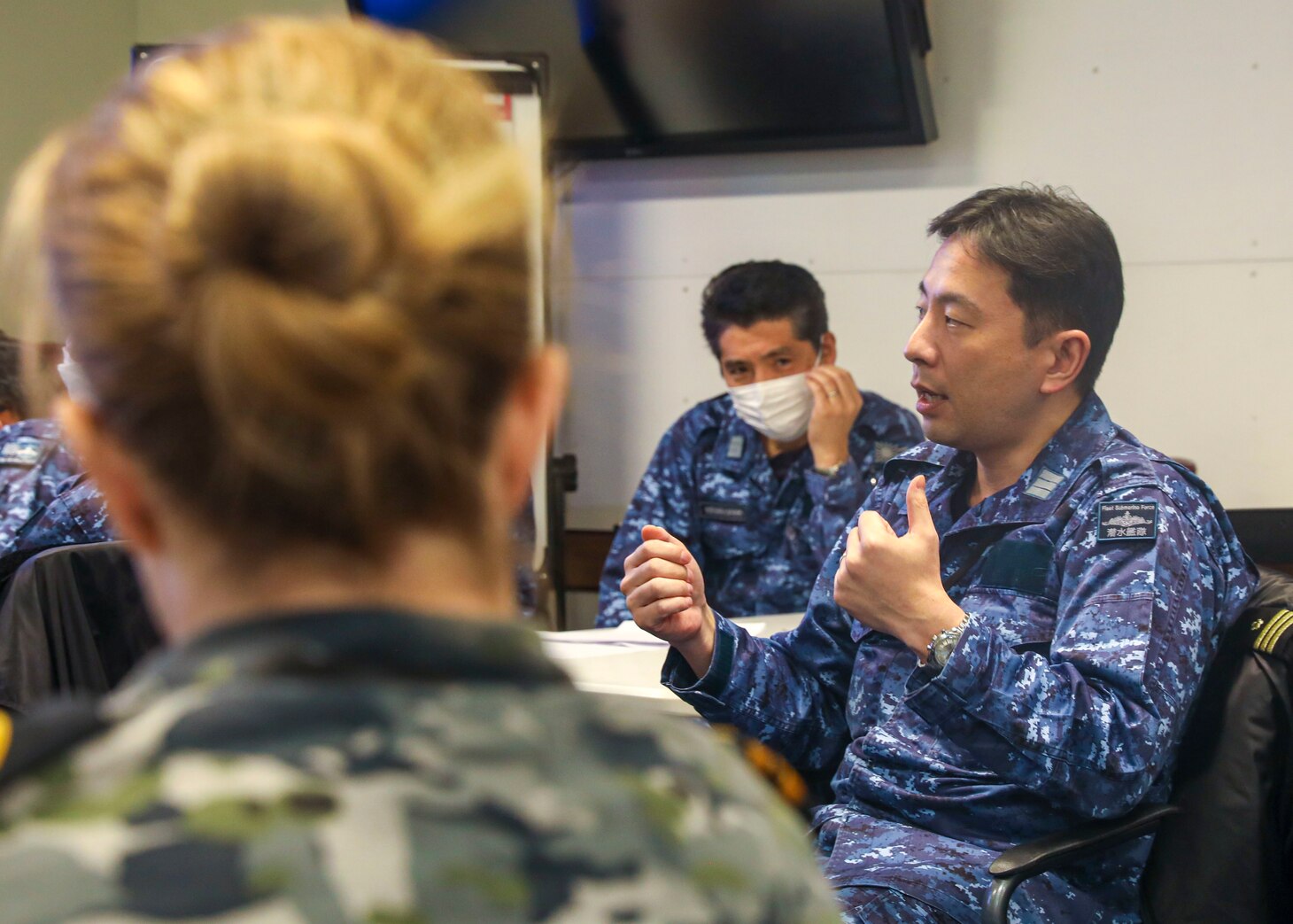 YOKOSUKA, Japan (Feb. 15, 2023) Sailors from the U.S. Navy, Japan Maritime Self-Defense Force (JMSDF), and Royal Australian Armed Forces from the Australian Headquarters Joint Operations Command (HQJOC) discuss lessons learned during the trilateral theater anti-submarine warfare (TASW) tabletop exercise (TTX) at Commander, Fleet Activities Yokosuka. The TTX was held to improve information sharing, coordination, and communication between the three countries and across all domains of undersea warfare. (U.S. Navy photo by Mass Communication Specialist 2nd Class Arthur Rosen)