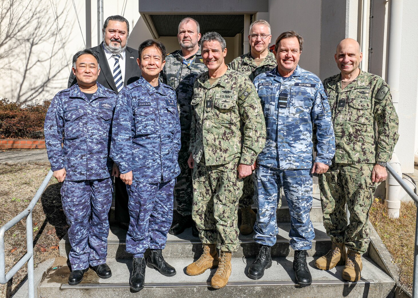 YOKOSUKA, Japan (Feb. 16, 2023) Senior leaders from the U.S. Navy, Japan Maritime Self-Defense Force (JMSDF), Royal Australian Air Force (RAAF) and Royal Australian Navy (RAN) pose for a photo following the trilateral theater anti-submarine warfare (TASW) working group (TTASWWG) at Commander, Fleet Activities Yokosuka. The TTASWWG helped improve information sharing, coordination, and communication between the three countries and across all domains of undersea warfare. (U.S. Navy photo by Mass Communication Specialist 2nd Class Arthur Rosen)