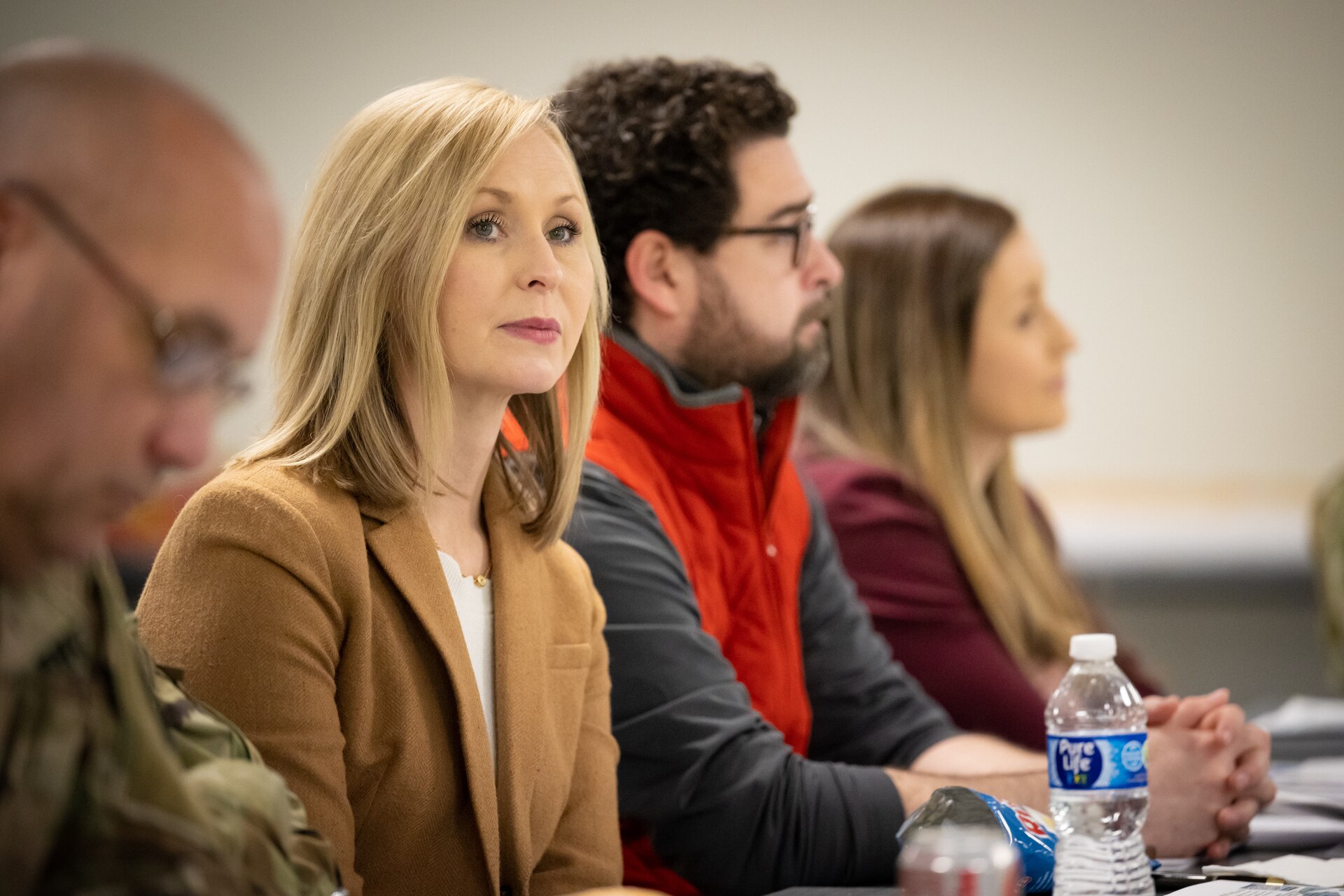 Danielle Smoot, communications director for U.S. Rep. Hal Rogers, attends a briefing on the missions sets and capabilities of the Kentucky National Guard during a visit to the Kentucky Air National Guard Base in Louisville, Ky., Feb. 17, 2023. Smoot also met with Soldiers and Airmen, and received hands-on familiarization with mission-essential equipment, including rocket launchers, helicopters and fixed-wing aircraft. (U.S. Air National Guard photo by Dale Greer)