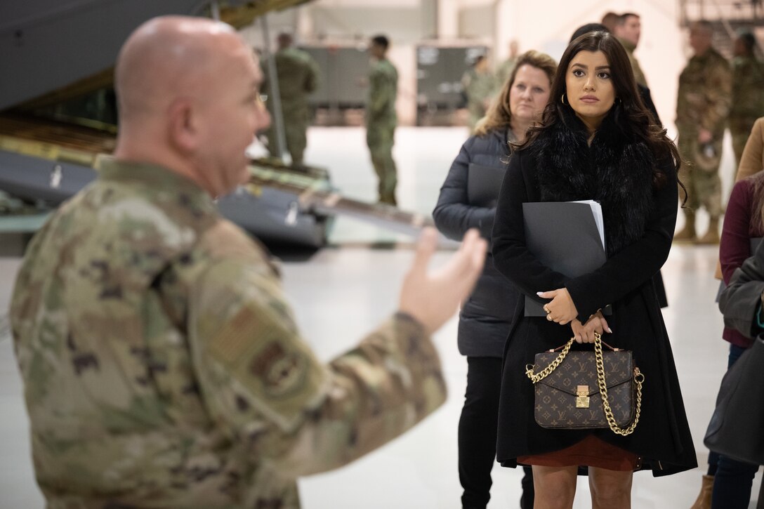 U.S. Air Force Senior Master Sgt. Chris Tellis of the 123rd Contingency Response Group briefs Carsen Parker, a field representative for U.S. Rep. Brett Guthrie, about unit capabilities Feb. 17, 2023, at the Kentucky Air National Guard Base in Louisville, Ky. Parker and 10 other staffers from Kentucky's Congressional Delegation toured the base to learn more about the mission sets of the Kentucky National Guard. (U.S. Air National Guard photo by Dale Greer)