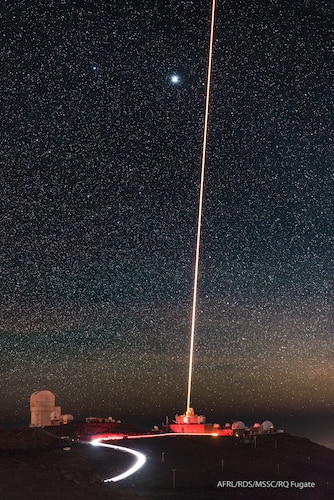 The Air Force Maui Optical and Supercomputing site, or AMOS, Maui Space Surveillance Complex, or MSSC, sits on the summit of Haleakala on the island of Maui, Hawaii. The MSSC, operated under the 15th Space Surveillance Squadron, hosts several Department of the Air Force space domain awareness, or SDA, sensors. The site’s 3.6-meter telescope, seen in the image projecting a sodium guidestar beam, is the largest optical telescope in the Department of Defense. This telescope and the site’s other smaller telescope systems support the U.S. Space Force’s SDA mission. The AMOS site operates experimental research and development systems under the Air Force Research Laboratory. (U.S. Air Force photo / Dr. Robert Q. Fugate)