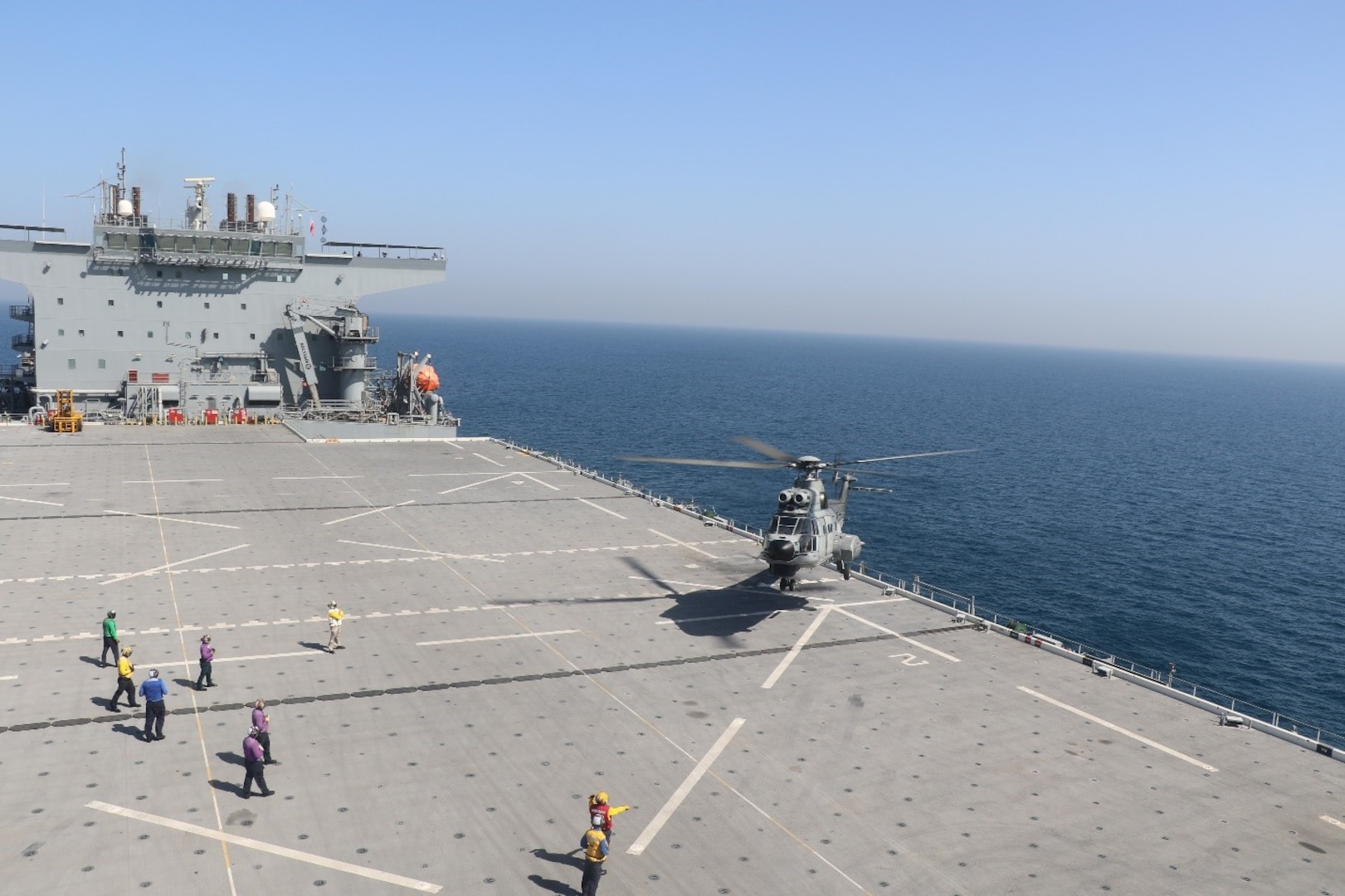 230224-N-NO146-1001 ARABIAN GULF (Feb. 24, 2023) – A United Arab Emirates Armed Forces AS332 Super Puma conducts deck landing qualifications aboard expeditionary sea base USS Lewis B. Puller (ESB 3) in the Arabian Gulf, Feb. 24, 2023. Puller is deployed to the U.S. 5th Fleet area of operations to help ensure maritime security and stability in the Middle East region.