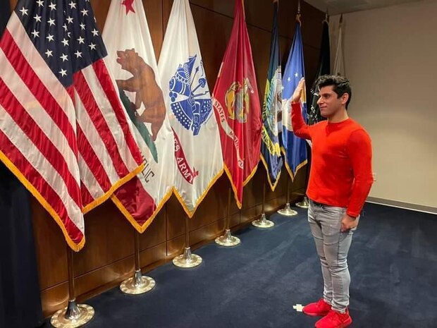 (Feb. 1, 2021) Musician 3rd Class Robert Novoa, then a U.S. Naval Recruit and now a member of the U.S. Naval Forces Europe-Africa (NAVEUR-NAVAF) Band, recites his oath of enlistment at a Military Entrance Processing Station. NAVEUR-NAVAF operates U.S. naval forces in the U.S. European Command (USEUCOM) and U.S. Africa Command (USAFRICOM) areas of responsibility. U.S. Sixth Fleet is permanently assigned to NAVEUR-NAVAF, and employs maritime forces through the full spectrum of joint and naval operations.