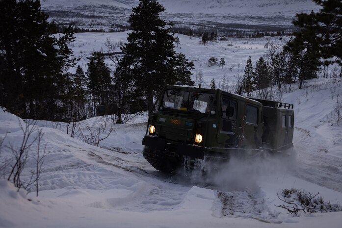A U.S. Marine with 2d Combat Engineer Battalion, 2d Marine Division, operates a Bandvagn 206 during the Belted Vehicle Course in Forset, Norway, Dec. 10, 2022.