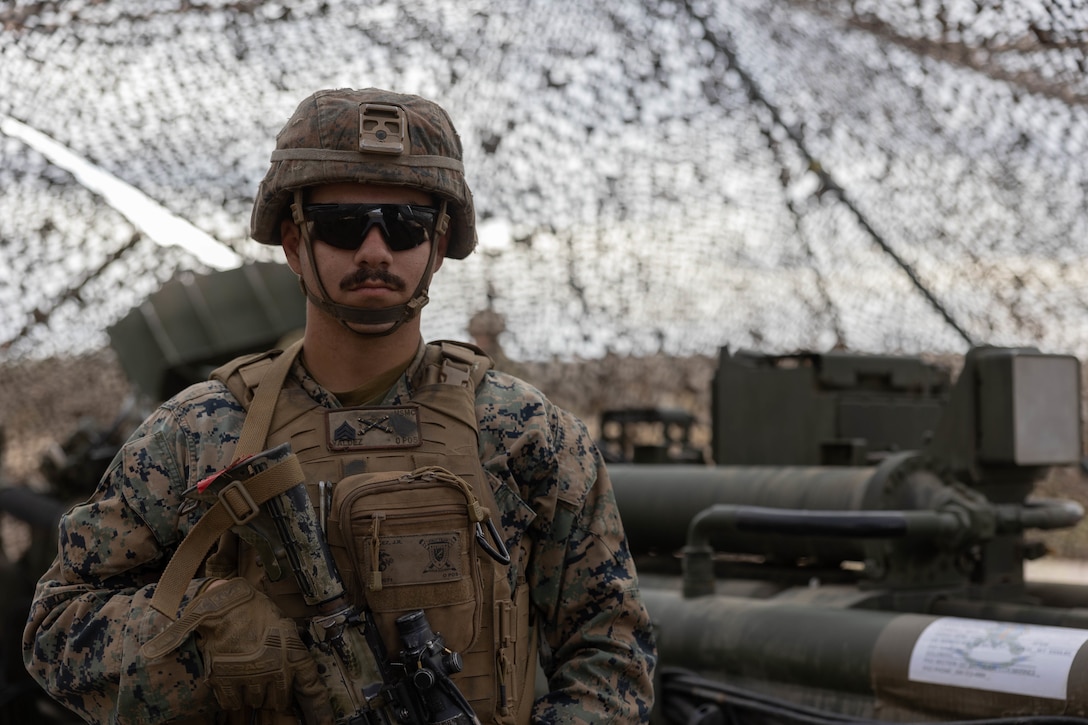 U.S. Marine Corps Sgt. Jordan Valdez, a field artillery cannoneer with Charlie Battery, 1st Battalion, 11th Marine Regiment, guards a gun position during exercise Steel Knight 23, on San Clemente Island, California, Dec. 6, 2022. Exercise Steel Knight 23 provides 1st Marine Division and 3rd Marine Aircraft Wing an opportunity to refine Division- and Wing-level warfighting in support of I Marine Expeditionary Force and fleet maneuver. Valdez is a Compton, California native.