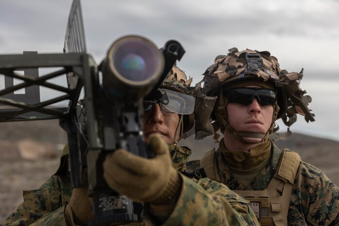 U.S. Marine Corps Lance Cpl. Alonso Guillen and U.S. Marine Corps Lance Cpl. Spencer Kirkwood, Low Altitude Air Defense gunners with 3rd Low Altitude Air Defense Battalion, Marine Air Control Group 38, 3rd Marine Aircraft Wing, use a Stinger Field Handling Trainer to practice tracking targets during exercise Steel Knight 23, on San Clemente Island, California, Dec. 6, 2022. 3rd LAAD provided close-in air defense to artillery positions for 1st Battalion, 11th Marine Regiment, 1st Marine Division. Exercise Steel Knight 23 provides 3rd MAW an opportunity to refine Wing-level warfighting in support of I Marine Expeditionary Force and fleet maneuver. Guillen is a Longmont, Colorado, native and Kirkwood is an O’Fallon, Illinois, native.