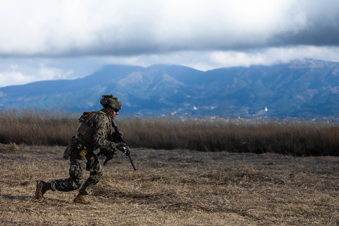 A U.S. Marine with 1st Battalion, 2d Marines maneuvers to his objective in support of a high-explosive range during Fuji Viper 23.1 at Combined Arms Training Center, Camp Fuji, Japan, Dec. 6, 2022. Exercise Fuji Viper exemplifies a commitment to realistic training that produces lethal, ready, and adaptable forces capable of decentralized operations across a wide range of missions. 1/2 is forward deployed in the Indo-Pacific under 4th Marines, 3d Marine Division as part of the Unit Deployment Program.