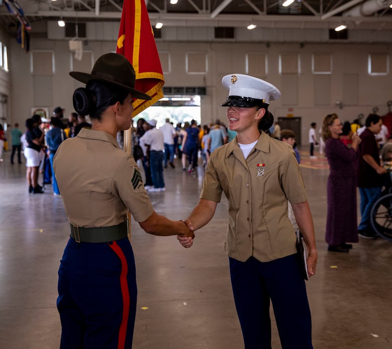 Pfc. Kylie Hathaway thanks her drill instructor at her graduation ceremony on Marine Corps Recruit Depot Parris Island S.C., May 27, 2022. Hathaway began training on the west coast at Marine Corps Recruit Depot San Diego and was transferred to MCRD Parris Island after an injury to her tibia required her to enter a recovery platoon. (U.S. Marine Corps photo by Lance Cpl. Michelle Brudnicki)