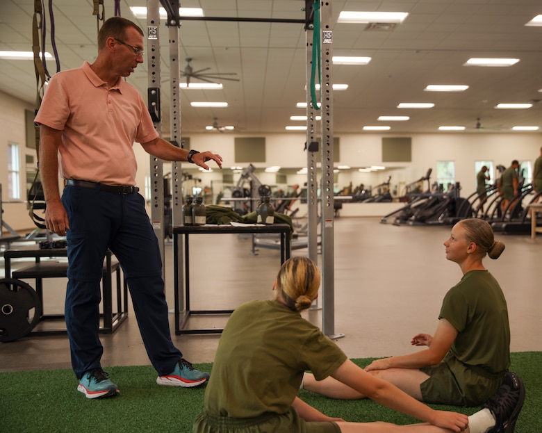 Sports Medicine Injury Prevention Trainer Jay Gibson assists recruits with Romeo Company, Support Training Battalion on Marine Corps Recruit Depot Parris Island S.C., Sep. 28, 2022. Romeo Company, formerly known as Special Training Company, is a rehabilitation, recovery, and reconditioning company with the mission of getting recruits back to the fight. (U.S. Marine Corps Photo by Sgt. Ryan Hageali)