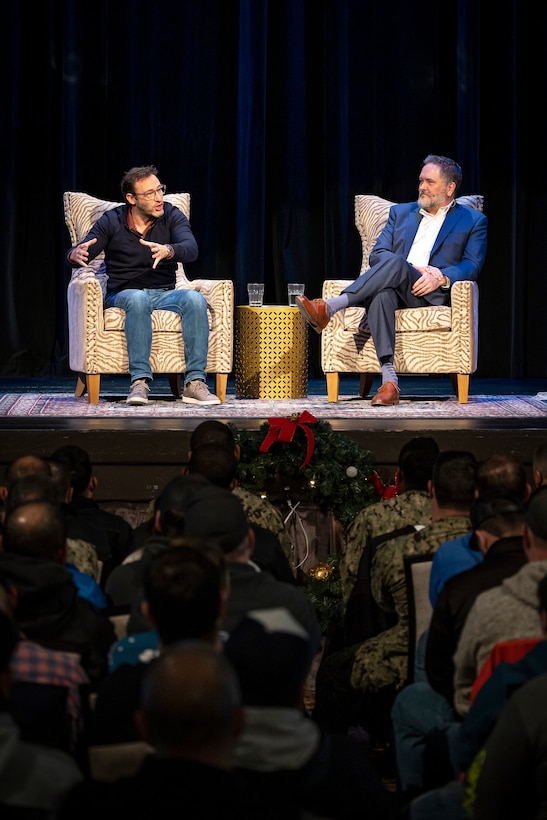 Author Simon Sinek, left, answers questions for Puget Sound Naval Shipyard & Intermediate Maintenance Facility employees during a conversation with Rob Gorman, PSNS & IMF director of Process Improvement and Change Management, Dec. 13, 2022, at the Admiral Theater in Bremerton, Washington. (U.S. Navy photo by Scott Hansen)