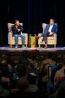 Author Simon Sinek, left, answers questions for Puget Sound Naval Shipyard & Intermediate Maintenance Facility employees during a conversation with Rob Gorman, PSNS & IMF director of Process Improvement and Change Management, Dec. 13, 2022, at the Admiral Theater in Bremerton, Washington. (U.S. Navy photo by Scott Hansen)