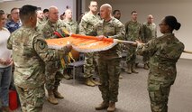 Maj. Nathan B. Gadberry, 53rd Signal Battalion (Satellite Control) commander, cases the unit’s colors for the last time with former and remaining Soldiers of the battalion on Dec. 5 at Peterson Space Force Base, Colorado. Prior to the casing ceremony, the 53rd Signal Battalion was the oldest operational battalion under the U.S. Army Space and Missile Defense Command, first in the 1st Space Brigade before transferring to the Army’s Satellite Operations Brigade in 2019. (U.S. Army National Guard photo by Maj. William J. Smith)