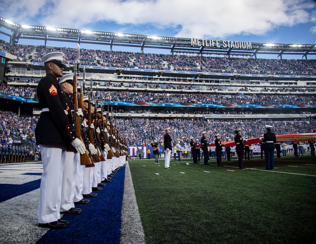 Marines with the Silent Drill Platoon execute present arms during the National Anthem at the New York Giants vs. Houston Texans game at the MetLife Stadium on Nov. 13, 2022. This weekend marked the final performances of several Marines in the Silent Drill Platoon as they prepared to rotate to their following duty stations in the Fleet Marine Force. Fair winds and following seas, Marines. (U.S. Marine Corps photo by Cpl. Mark Morales)