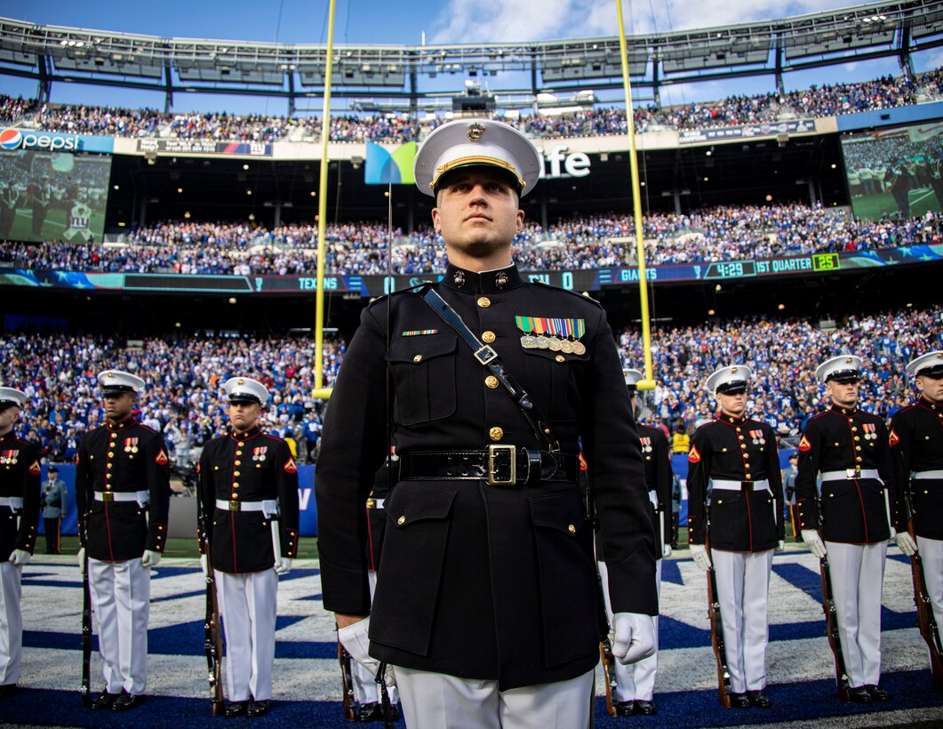 Marines with the Silent Drill Platoon stand at the position of attention at the New York Giants vs. Houston Texans game at the MetLife Stadium on Nov. 13, 2022. This weekend marked the final performances of several Marines in the Silent Drill Platoon as they prepared to rotate to their following duty stations in the Fleet Marine Force. Fair winds and following seas, Marines. (U.S. Marine Corps photo by Cpl. Mark Morales)
