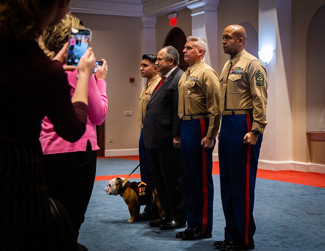 Marines stand at attention for honors during a promotion ceremony at Marine Barracks Washington, December 13th, 2022. Chesty XVI, mascot of the Marine Corps, was promoted to the rank of Private First Class by the Honorable Carlos Del Toro, Secretary of the Navy. (U.S. Marine Corps photo by Lance Cpl. Pranav Ramakrishna)
