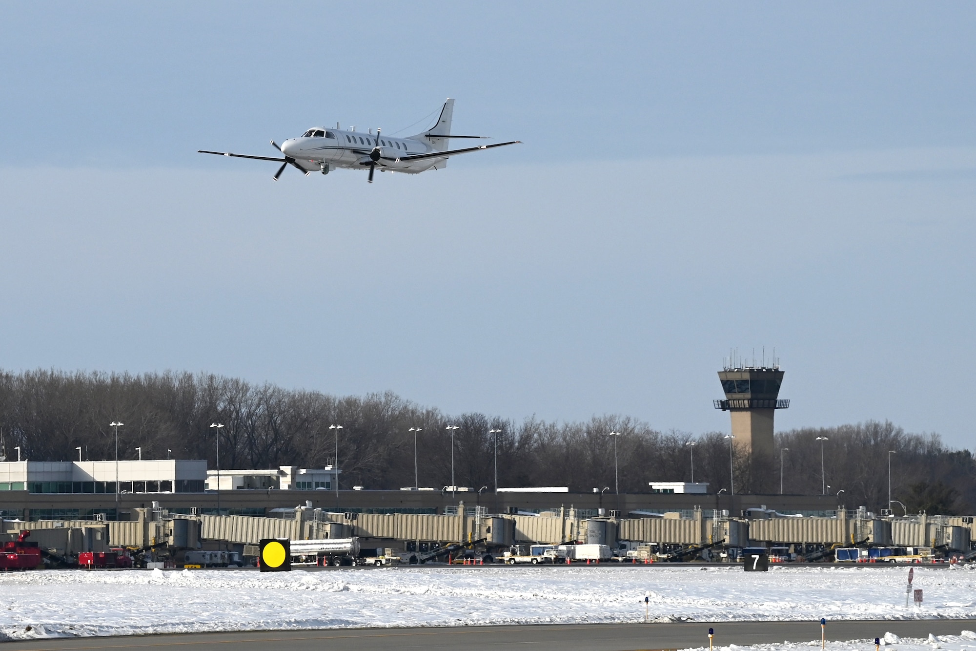 The Wisconsin Air National Guard's RC-26B reconnaissance aircraft makes a final pass over Dane County Regional Airport in Madison, Wisconsin Dec. 28, 2022.