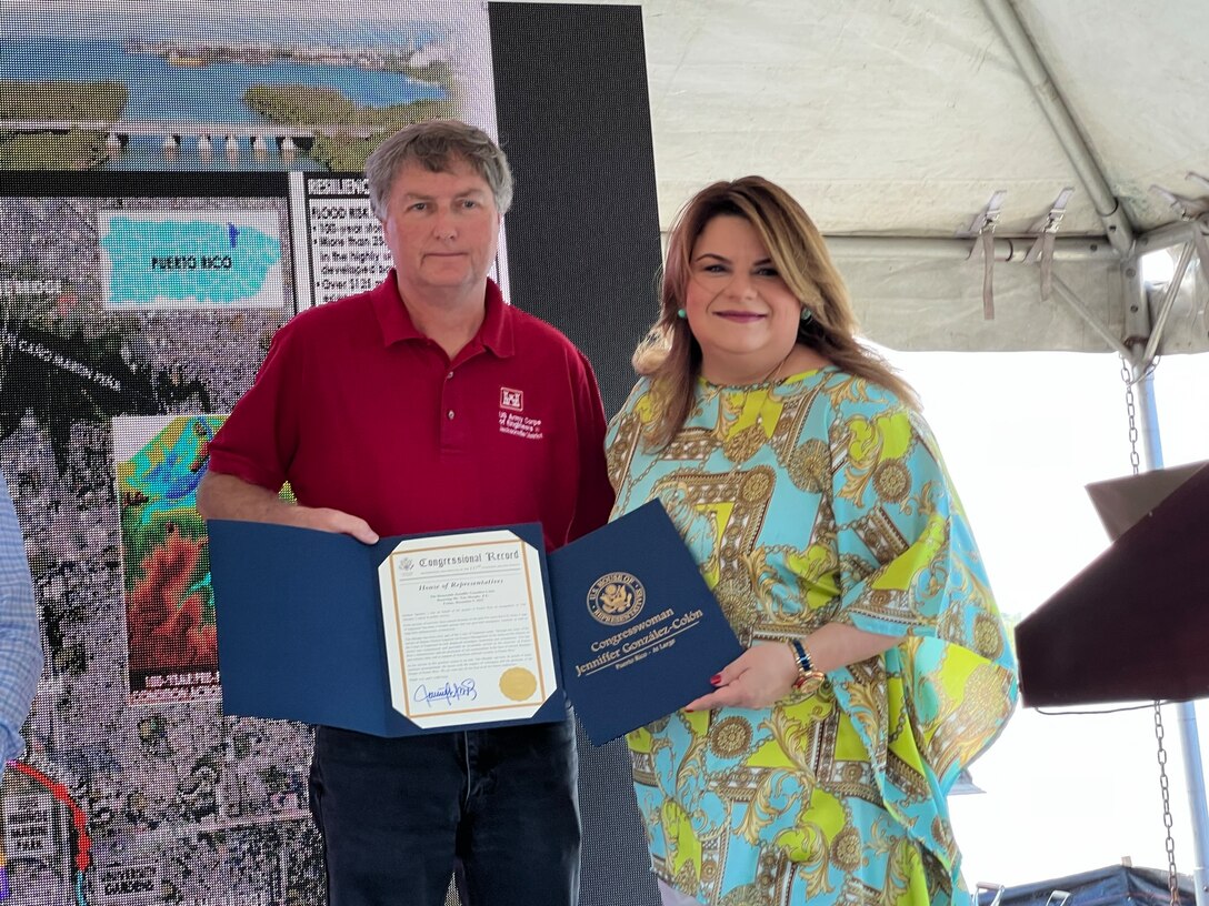 On Dec. 9, 2022, during a recent tour of current projects in San Juan Puerto Rico, Congresswoman Jenniffer Gonzalez-Colon (right) presented Tim Murphy with a congressional citation for his steadfast work and dedication to see projects in Puerto Rico completed. (USACE photo by Mark Rankin)