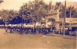 The Illinois National Guard’s 2nd Infantry Regiment enters the gates of Camp Lincoln, Springfield, in the late 1800s. Vendors used to gather at the gate of Camp Lincoln to sell to the thousands of Soldiers that trained at the facility. The Illinois National Guard will celebrate its 300th year in 2023 with communities across the state.