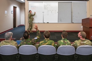 U.S. Air Force Staff Sgt. Cortney Haralson, F-35 Partner Intelligence Formal Training Unit instructor, lectures on radar systems, Nov. 10, 2022, at Luke Air Force Base, Arizona.