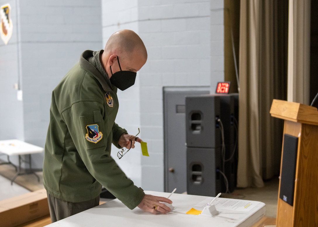 412th Test Wing Commander, Brig. Gen. Matthew Higer submits a COVID-19 self-test kit at the Single Point Screening Facility Test Facility (SPSTF) at the Base Theater on Edwards Air Force Base, California. The SPSTF will hold COVID-19 proactive screening tests Jan. 4-12, from 7:30 a.m. to 4 p.m. (Air Force photo by Giancarlo Casem)