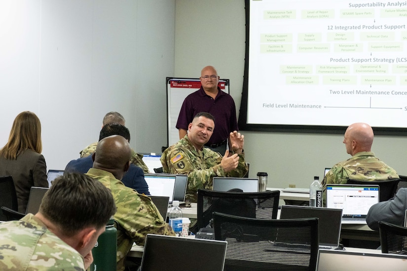 Army Medical Logistics Command Chief Warrant Officer 5 Lee Nelson talks to other members of the medical maintenance group during a workshop on Medical Logistics in Campaigning and its impact on the National Guard and Reserve at Fort Sam Houston, Texas, Nov. 29.