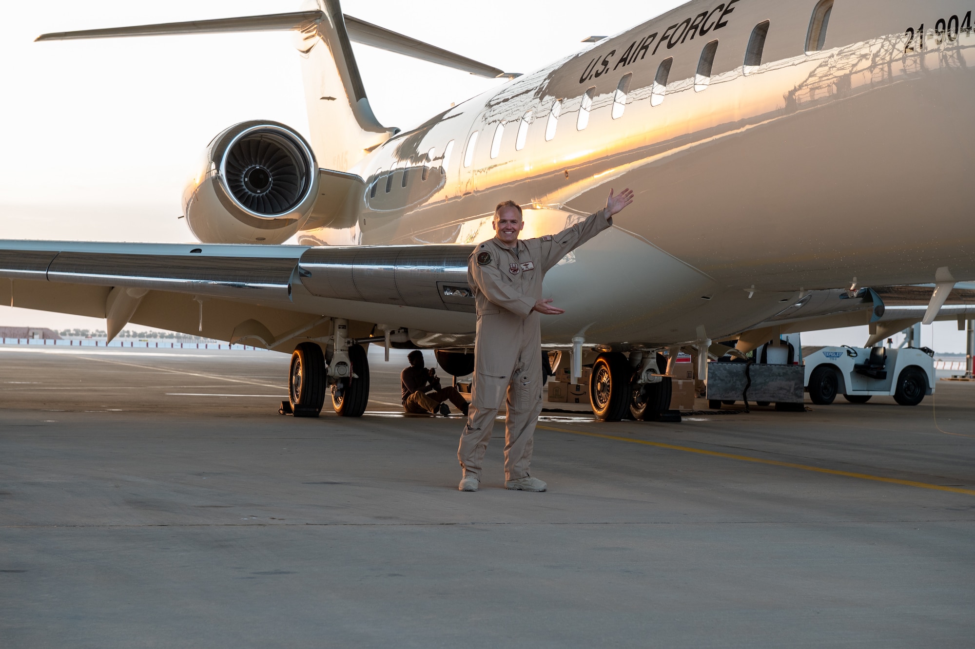U.S. Air Force Lt. Col. Todd Arthur, the 430th Expeditionary Electronic Communications Squadron commander poses for a photo next to new U.S. Air Force E-11A BACN aircraft arrives at Prince Sultan Air Base, Kingdom of Saudi Arabia, Dec. 16, 2022.