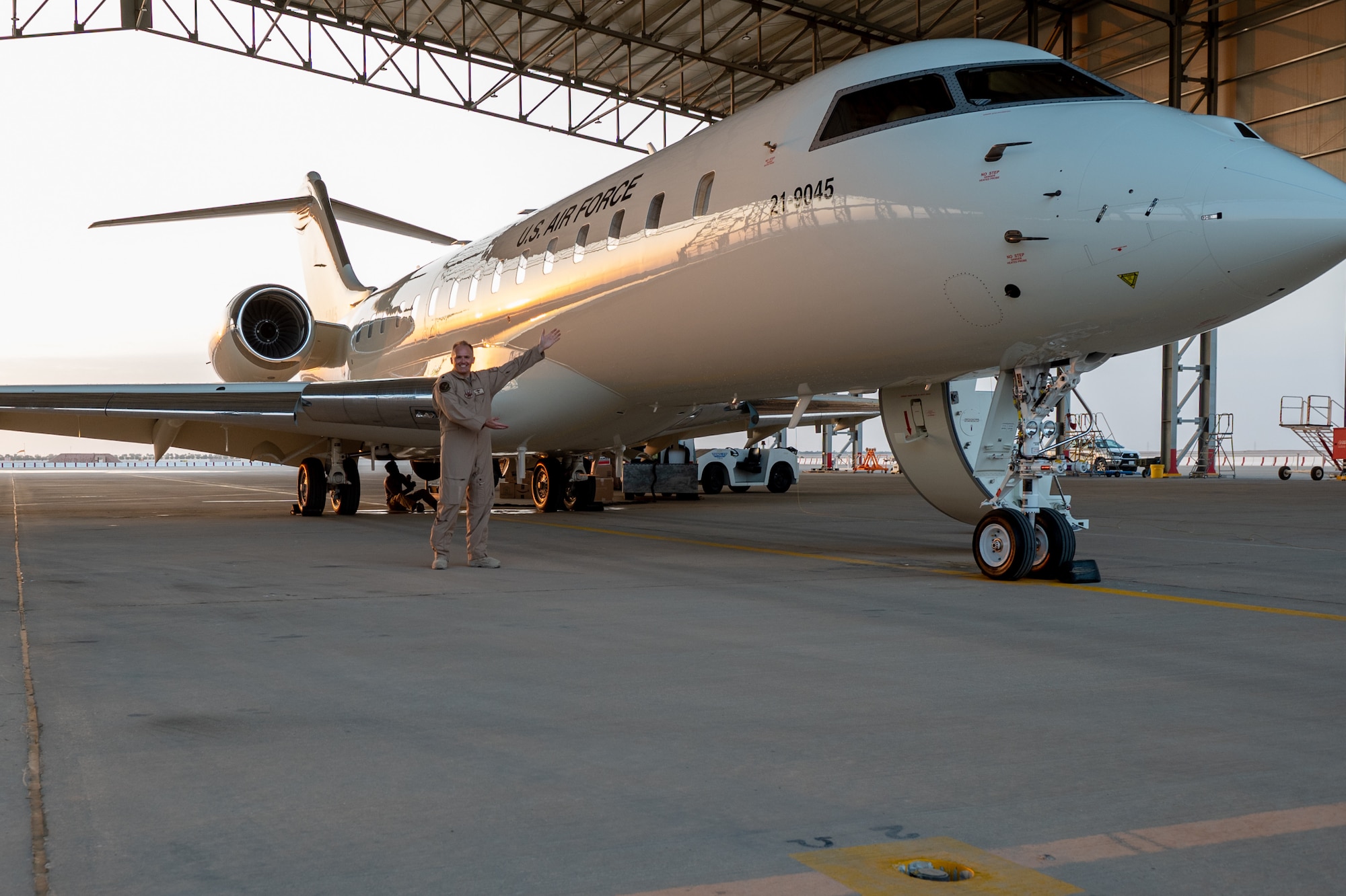 U.S. Air Force Lt. Col. Todd Arthur, the 430th Expeditionary Electronic Communications Squadron commander poses for a photo next to new U.S. Air Force E-11A BACN aircraft arrives at Prince Sultan Air Base, Kingdom of Saudi Arabia, Dec. 16, 2022.