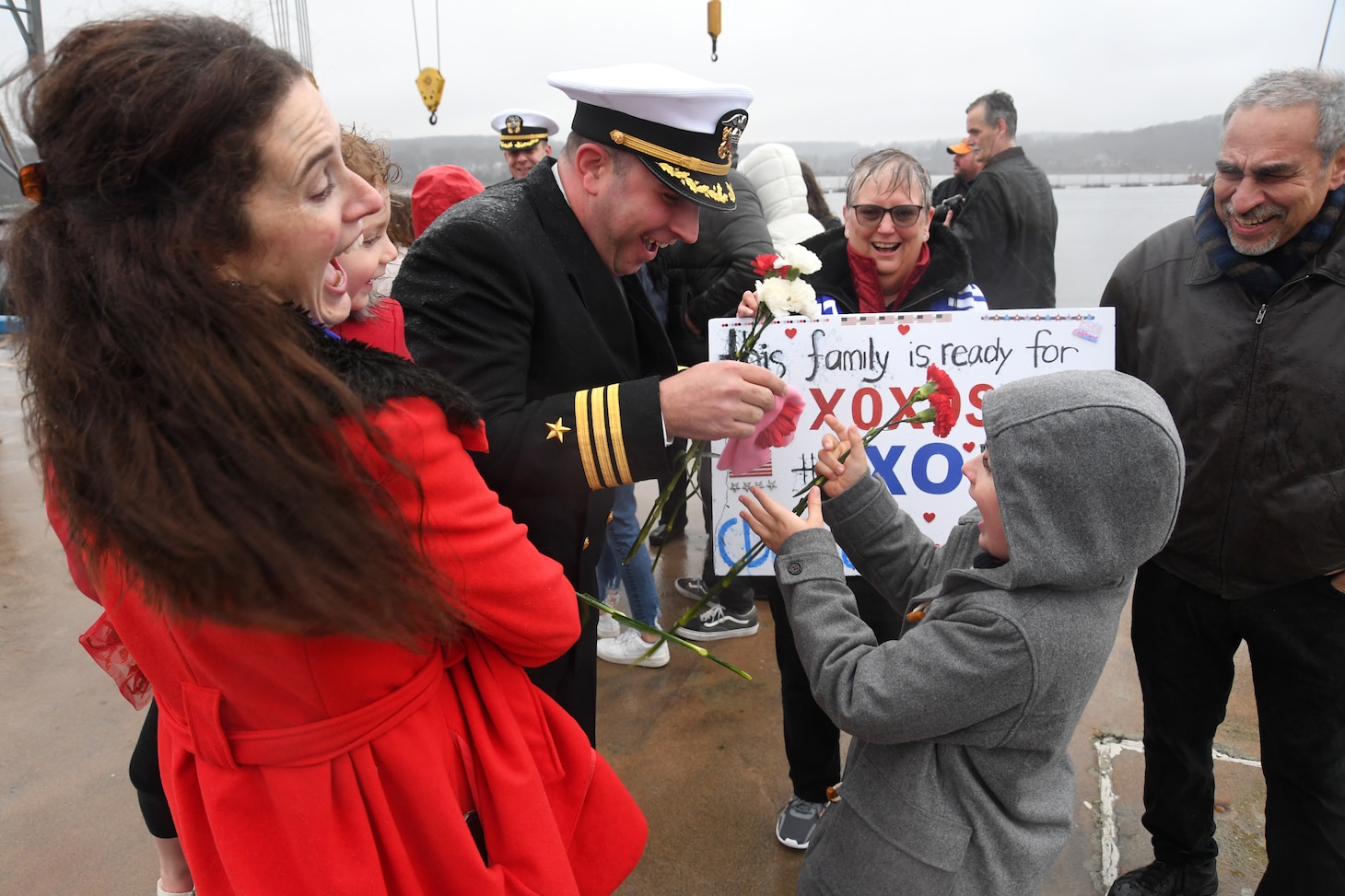 Cmdr. Matthew Lewis, executive officer attached to the for the USS Newport News (SSN 750), reunites with his family during a homecoming event at Naval Submarine Base New London in Groton, Conn., Jan. 3. Newport News returned to homeport after a six-month deployment in support of the chief of naval operations’ maritime strategy. The Los Angeles-class fast-attack submarine USS Newport News and crew operate under Submarine Squadron (SUBRON) TWELVE and its primary mission is to provide attack submarines that are ready, willing, and able to meet the unique challenges of undersea combat and deployed operations in unforgiving environments across the globe.