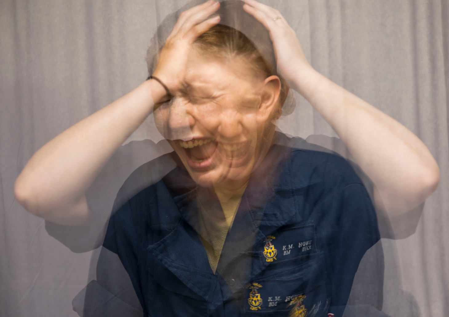 Blurred image of Sailor screaming and shaking head