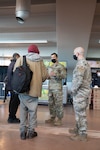 Members of the Colorado Air National Guard direct people seeking shelter at a warming center at the Denver Coliseum, Denver, Dec. 21, 2022. Gov. Jared Polis authorized the activation of up to 100 Colorado National Guard troops to assist the state emergency operations center with extreme cold weather support in response to a winter storm with temperatures expected to hit -50 degrees. (U.S. Army National Guard photo by Sgt. 1st Class Joseph K. VonNida)