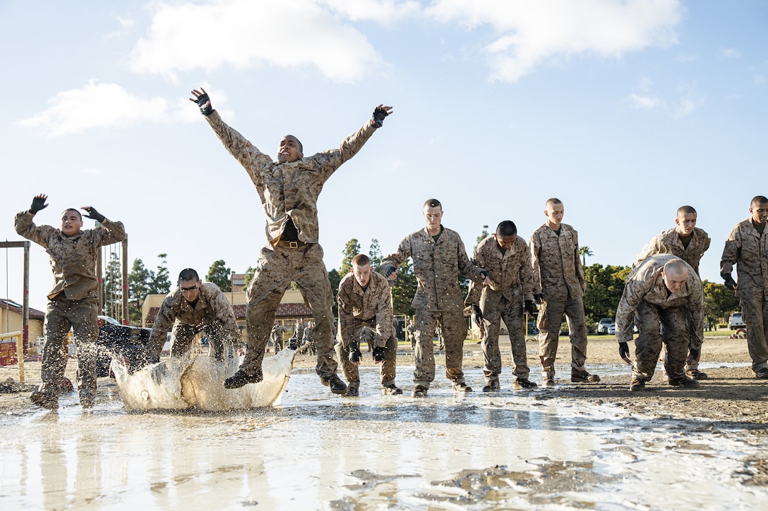 Marine Corps recruits participate in a conditioning course.