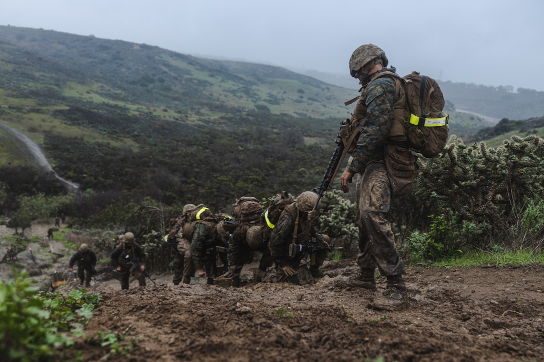 U.S. Marine Corps recruits with Bravo Company, 1st Recruit Training Battalion, participate in an obstacle during the Crucible at Camp Pendleton, Calif., Jan. 3, 2023. The Crucible is a 54-hour culminating event consisting of mentally and physically demanding challenges with limited food and sleep. (U.S. Marine Corps photo by Cpl. Tyler W. Abbott)