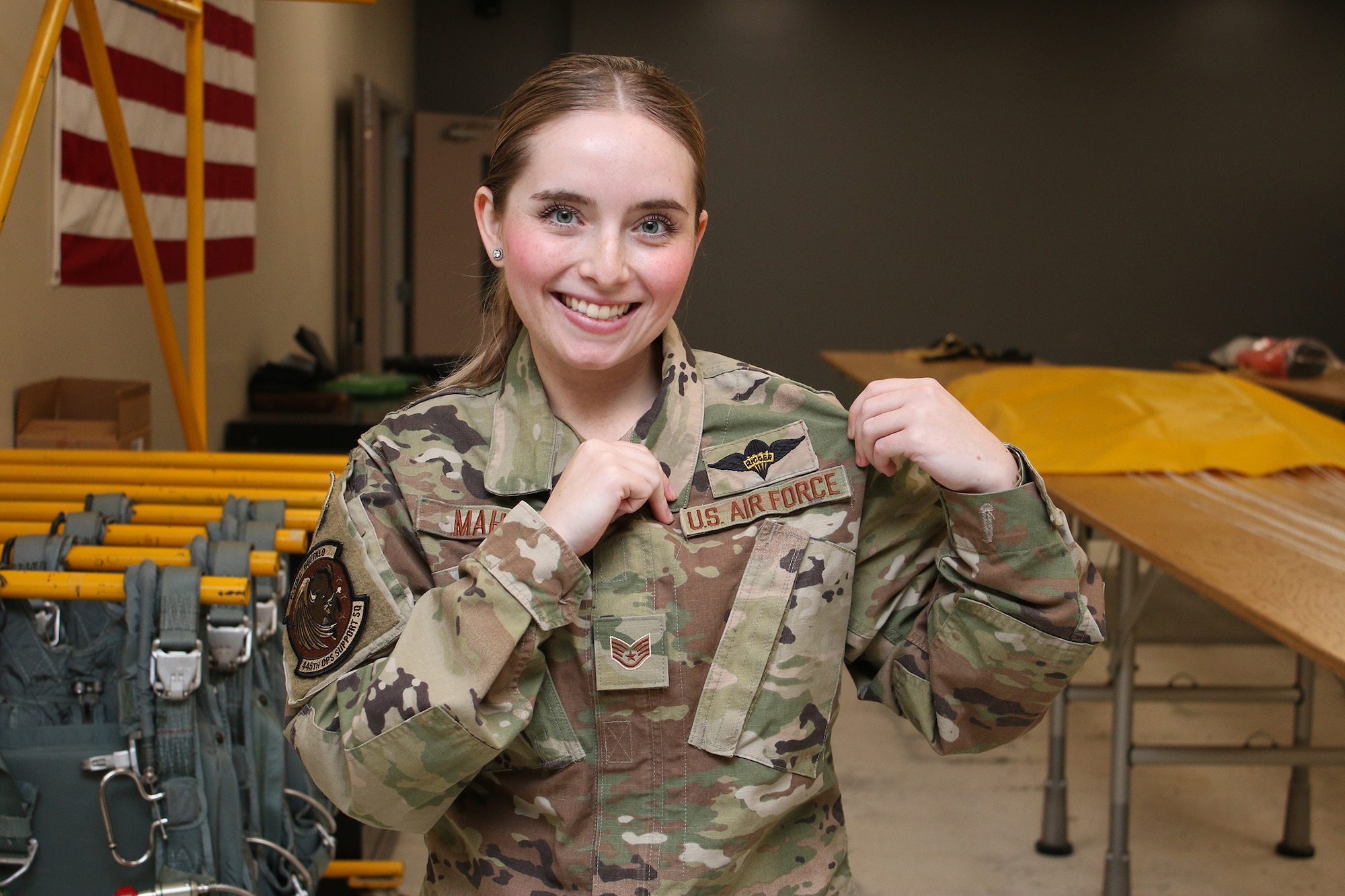 Staff Sgt. Sarah Maher, 445th Operations Support Squadron aircrew flight equipment technician shows off her Army parachute riggers patch. (U.S. Air Force photo/Tech. Sgt. Joel McCullough)
