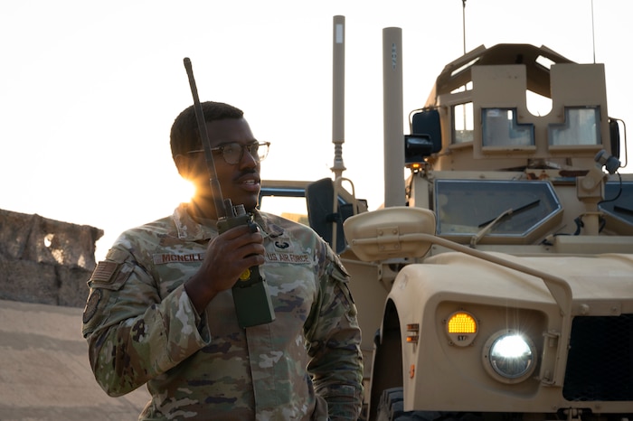 U.S. Air Force Senior Airman Byron McNeill Jr., 443rd Air Expeditionary Squadron supply technician and security forces fireteam lead, performs a radio check while inspecting the communication capability status of a Mine-Resistant Ambush Protected All-Terrain Vehicle on Al Asad Air Base, Iraq, Dec. 10, 2022. McNeill found a passion in upgrading and maintaining communication equipment after completing Squad Systems Operator training early in his career. (U.S. Air Force photo by Staff Sgt. Dalton Williams)