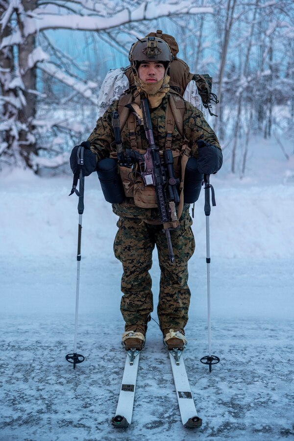 U.S. Marine Corps Cpl. Sami Shaw, a reconnaissance Marine with 2d Reconnaissance Battalion, 2d Marine Division, poses for a photo during cold weather training on Joint Base Elmendorf-Richardson, Alaska, Dec. 10, 2022. This training was conducted to enhance the unit’s combat effectiveness in extreme cold weather as they prepare for an upcoming deployment to Marine Corps Forces Europe-Africa theater of operations. (U.S. Marine Corps photo by Sgt. Dylan Chagnon)