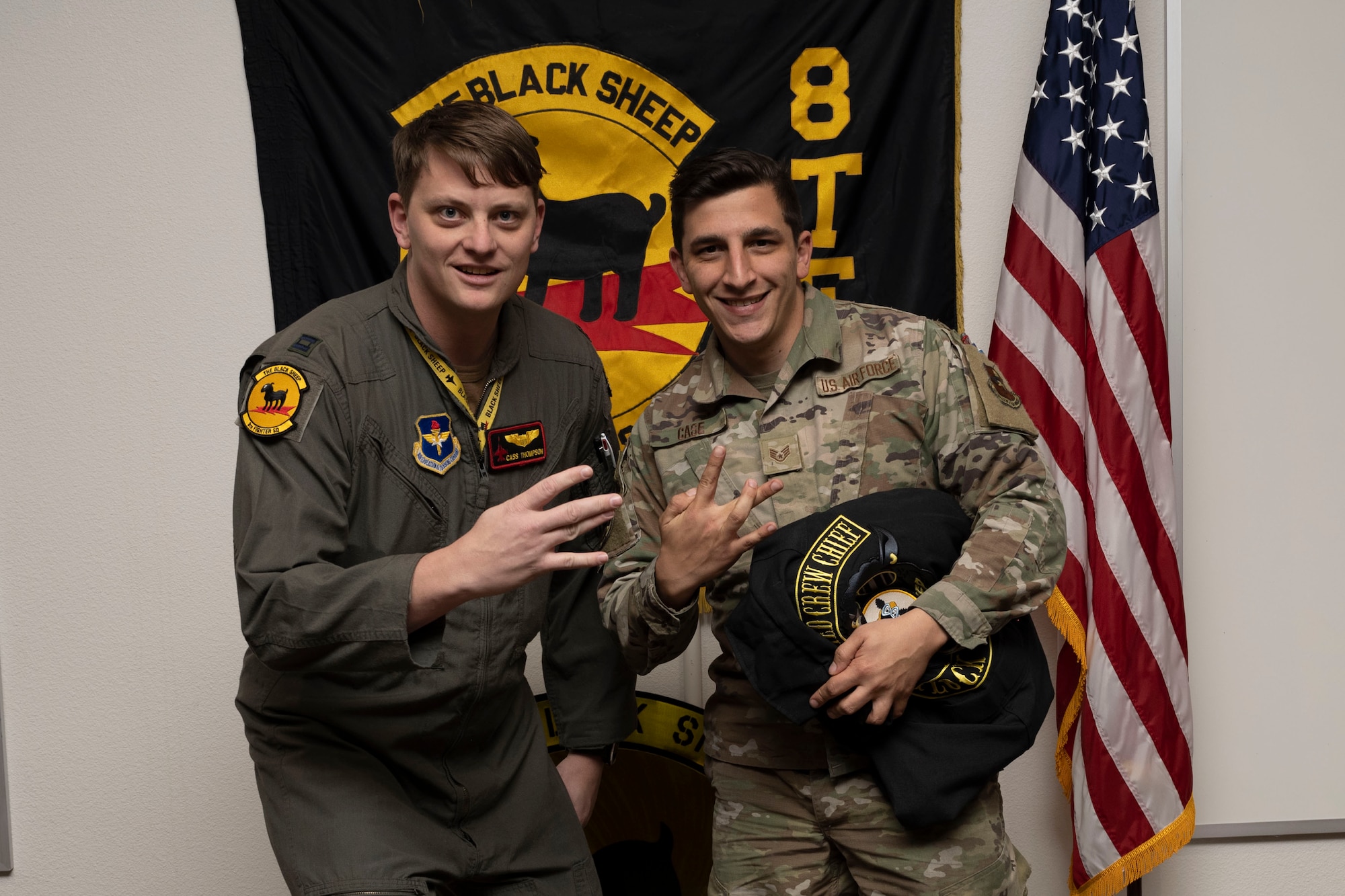 U.S. Air Force Staff Sgt. Timothy Case, 8th Aircraft Maintenance Unit crew chief, right, poses for a photo with U.S. Air Force Capt. Daniel Thompson, 8th Fighter Squadron pilot, during a Dedicated Crew Chief Appointment ceremony at Holloman Air Force Base, New Mexico, Jan. 3, 2022. To receive the title of DCC, a crew chief must demonstrate a history of superior performance in their career, comply with all safety practices and complete all required training. (U.S. Air Force photo by Senior Airman Antonio Salfran)