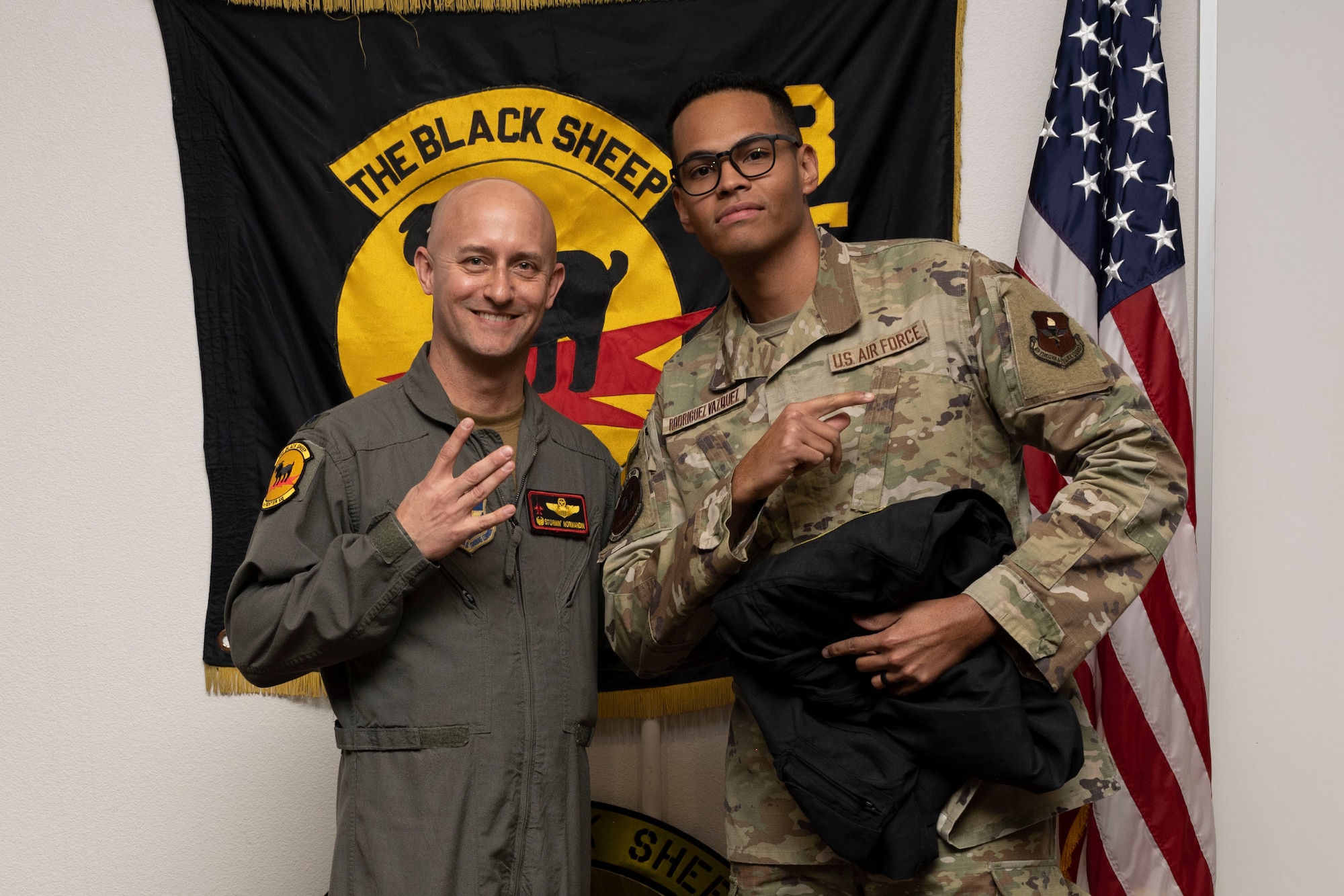 U.S. Air Force Staff Sgt. Aaron Rodgriguez-Vasquez, 8th Aircraft Maintenance Unit crew chief, right, poses for a photo with U.S. Air Force Lt. Col. George Normandin, 8th Fighter Squadron commander, during a Dedicated Crew Chief Appointment ceremony at Holloman Air Force Base, New Mexico, Jan. 3, 2022. To receive the title of DCC, a crew chief must demonstrate a history of superior performance in their career, comply with all safety practices and complete all required training. (U.S. Air Force photo by Senior Airman Antonio Salfran)