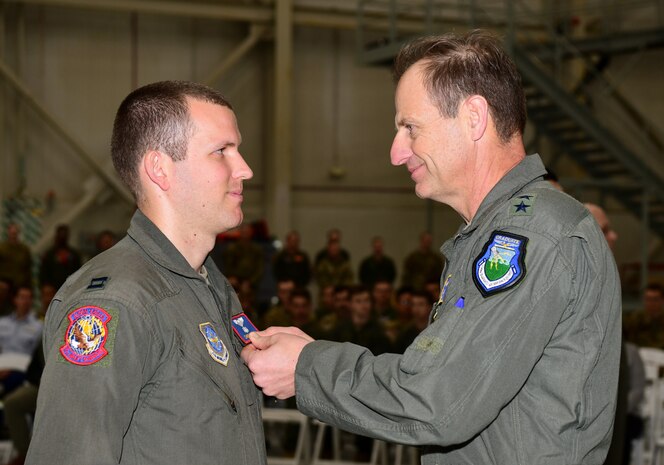 A photo of an Airman receiving a medal.