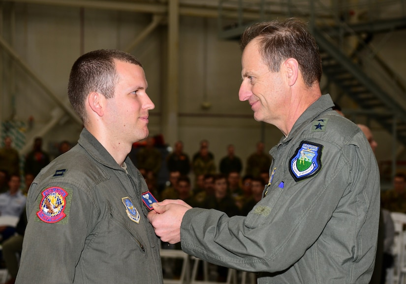 A photo of an Airman receiving a medal.