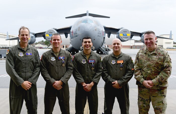 A group photo of the medal recipients.