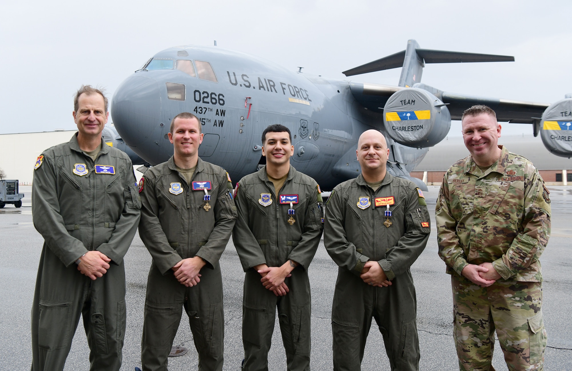 A group photo of the medal recipients.