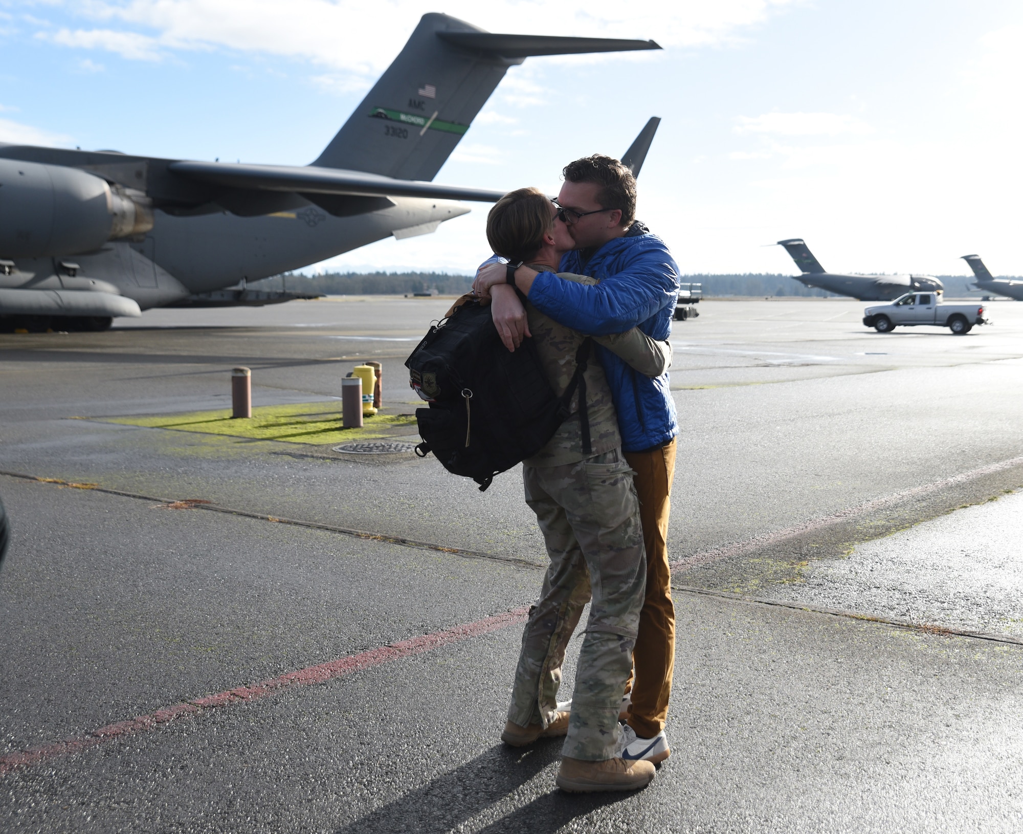 U.S. Air Force Capt. Kaitlyn Hawkinson, a C-17 Globemaster lll pilot with the 8th Airlift Squadron, greets her loved one on the flightline at Joint Base Lewis-McChord, Washington, Jan. 3, 2023. Hawkinson was one of many deployed Airmen reuniting with their friends and loved ones. (U.S. Air Force photo by Airman Kylee Tyus)